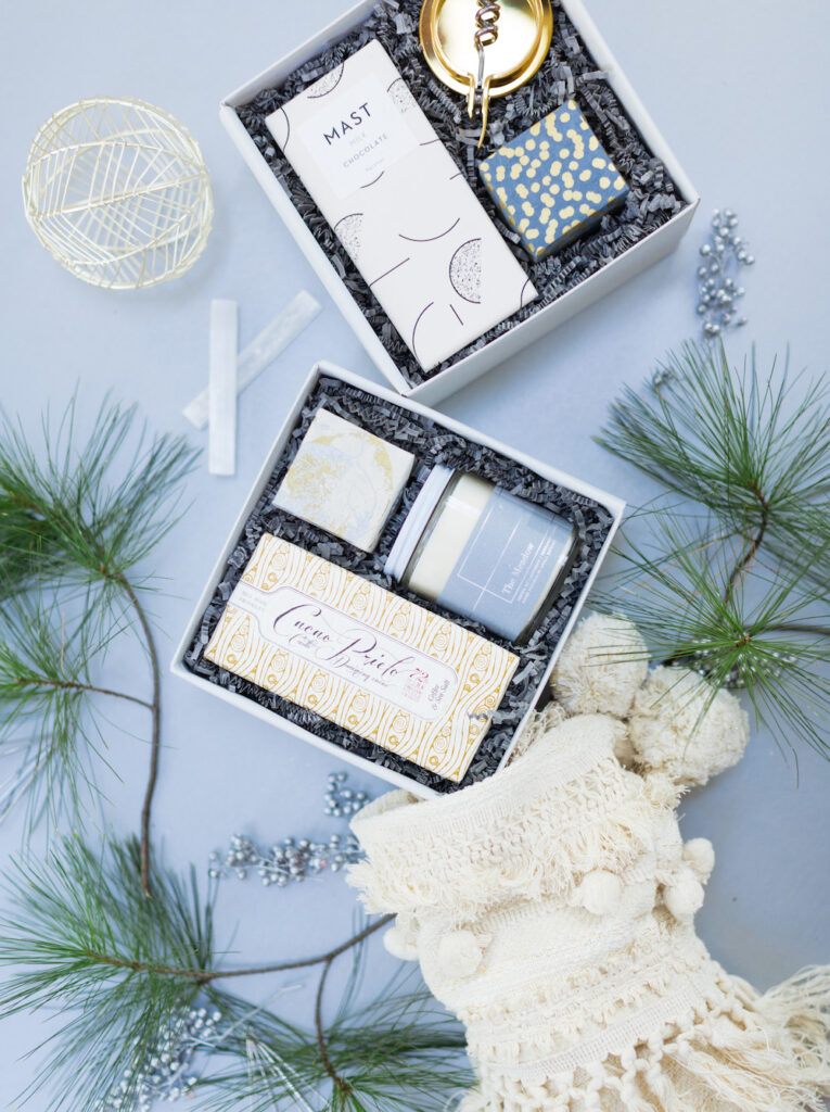Christmas themed giftbox flatlay for Teak and Twine featuring blue and white elements.